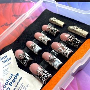 Black & white animal print with a touch of silver chrome. All sizes available.